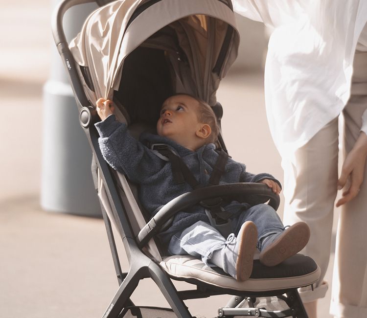 a-boy-sitting-in-a-NUBI-2-stroller